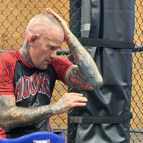Coach Devlin Crew in the cage at Zen Martial Arts in Chilliwack, BC